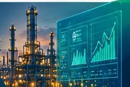 A process plant at night beside a live performance dashboard
